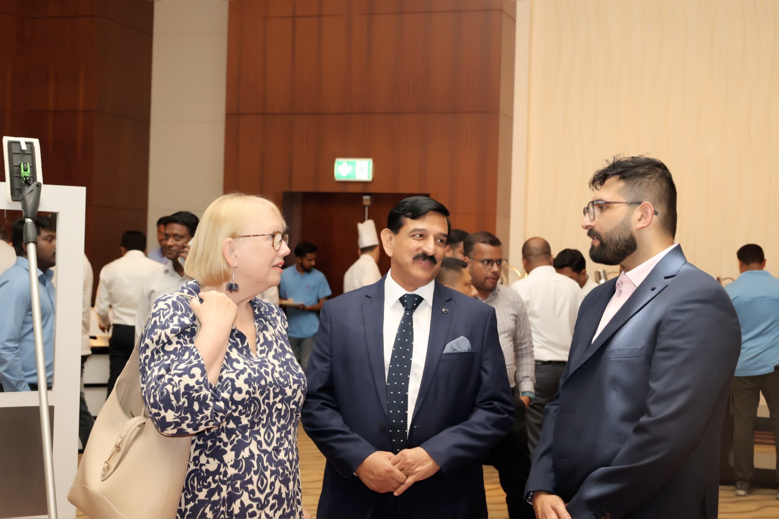 Delegates in conversation during a corporate networking event in Dubai