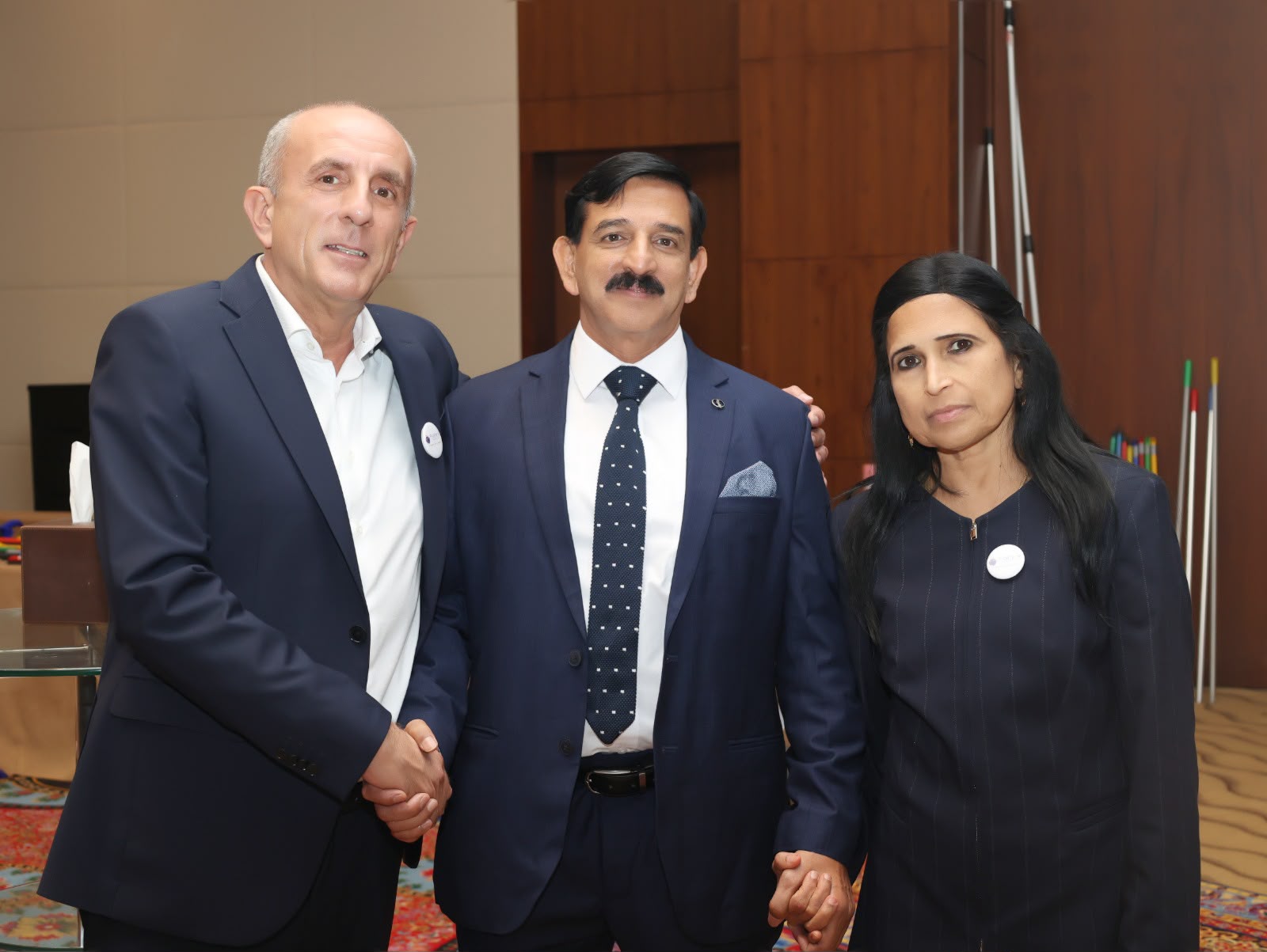Three guests posing together at a corporate awards evening in Dubai